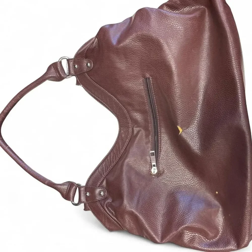 Brown leather handbag with flower